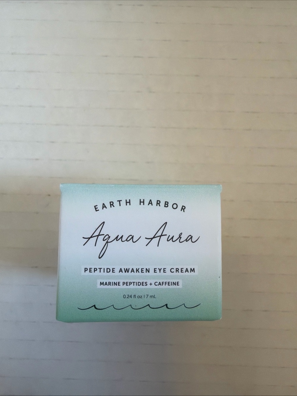 Earth Harbor Aqua Aura Peptide Awaken Eye Cream in a 0.24 fl oz size.